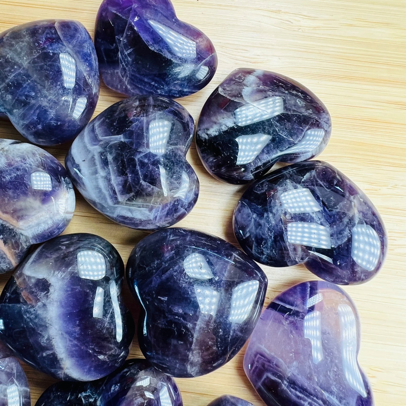 Bottom side of Amethyst polished heart, often kept for Stress Relief and Sleep, from Analamanga, Madagascar.