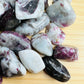 Top view of Pink Tourmaline tumbled stone, showing matte finish.