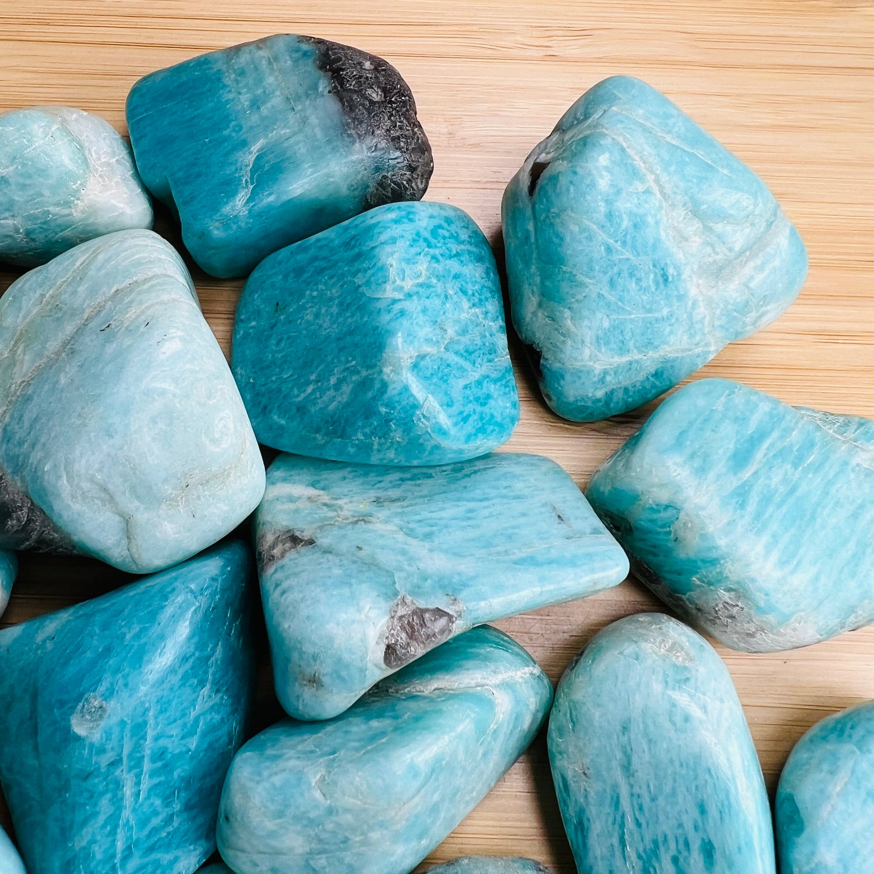 Alternate angle of Grade AA Amazonite tumbled stone showing overall shape