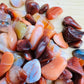 Alternate angle of Grade AA Carnelian tumbled stone showing overall shape