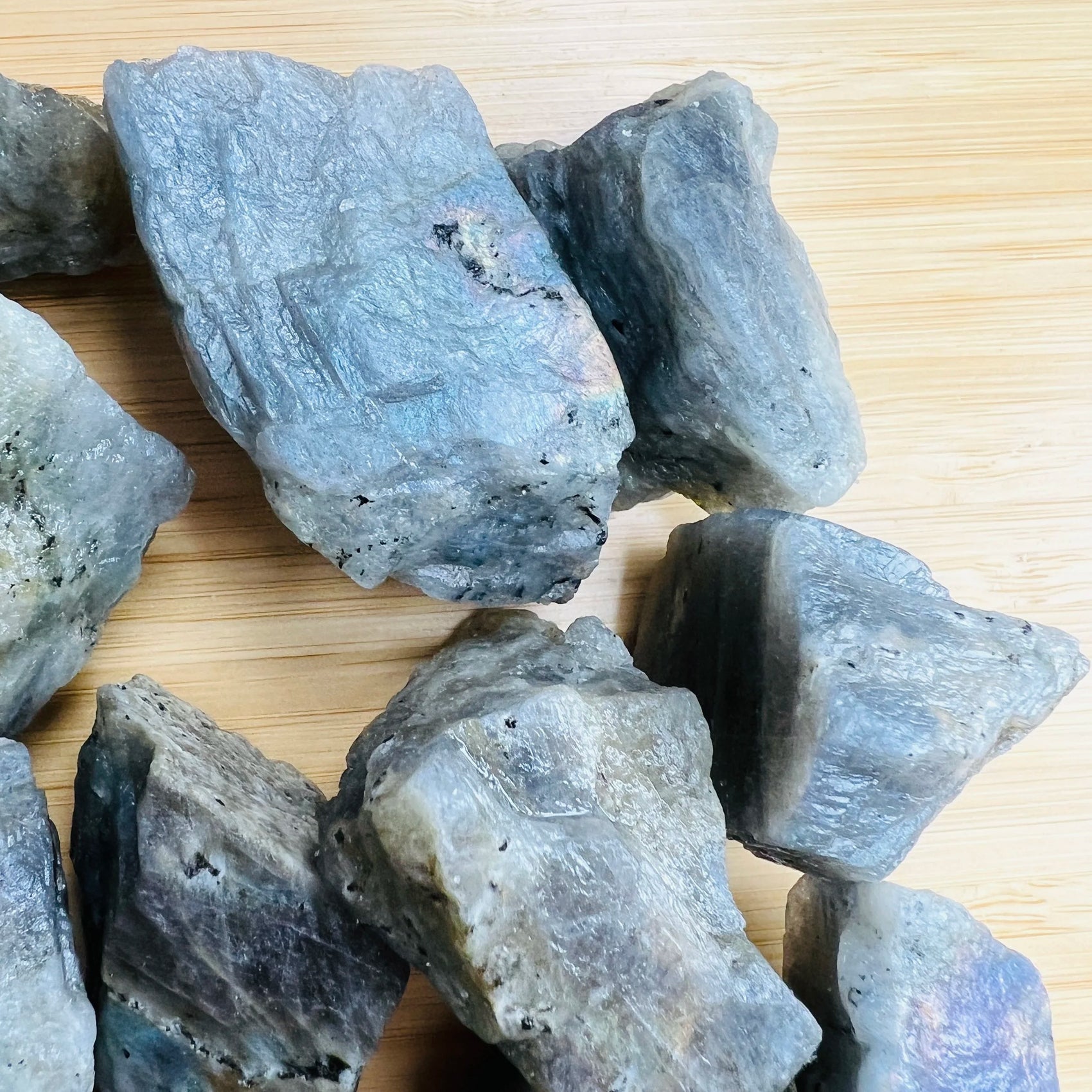 Natural light view of a Labradorite raw stone kept close for Intuition and Protection.