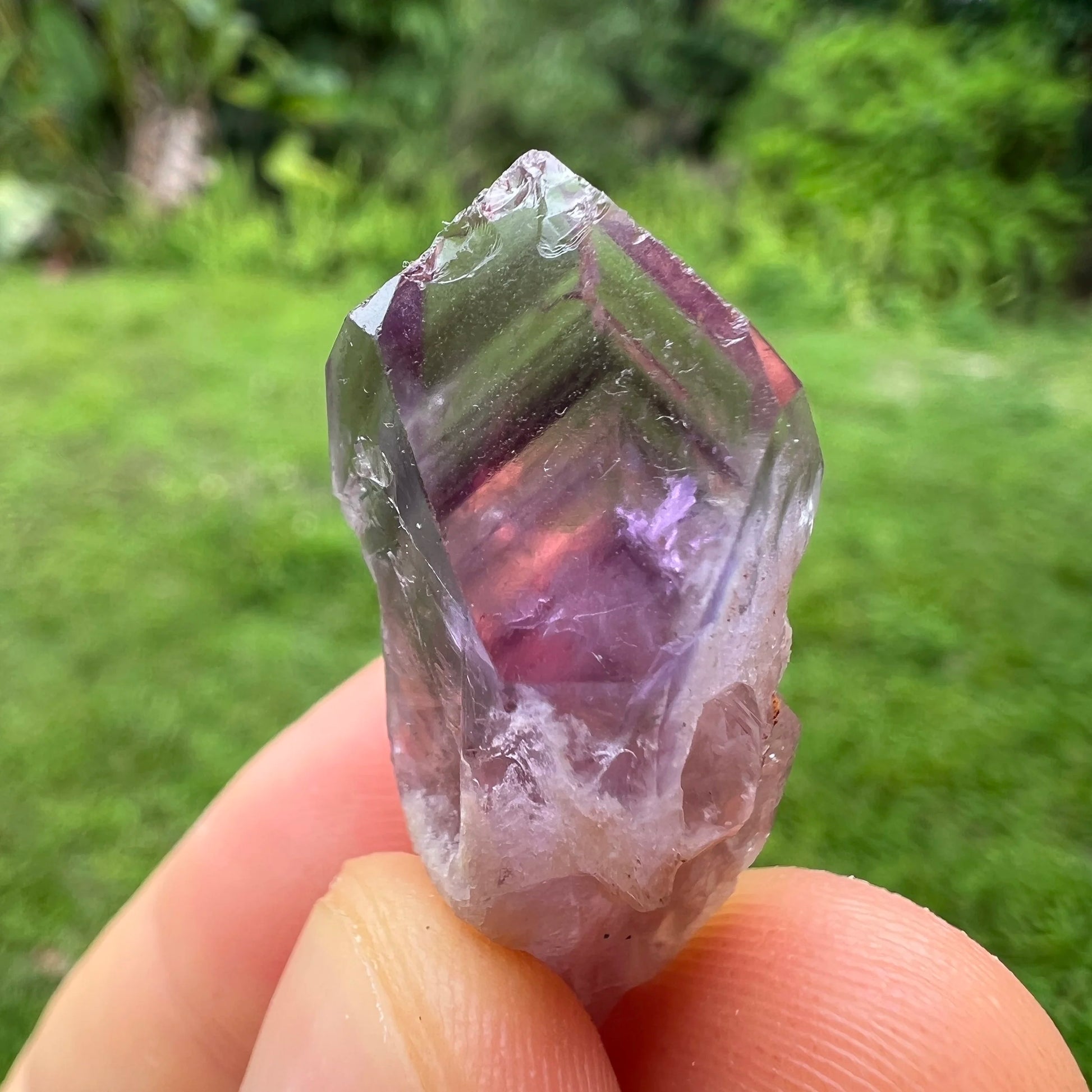 Edge-on view of Amethyst raw point, showing subtle veining, from Southern Province, Zambia.