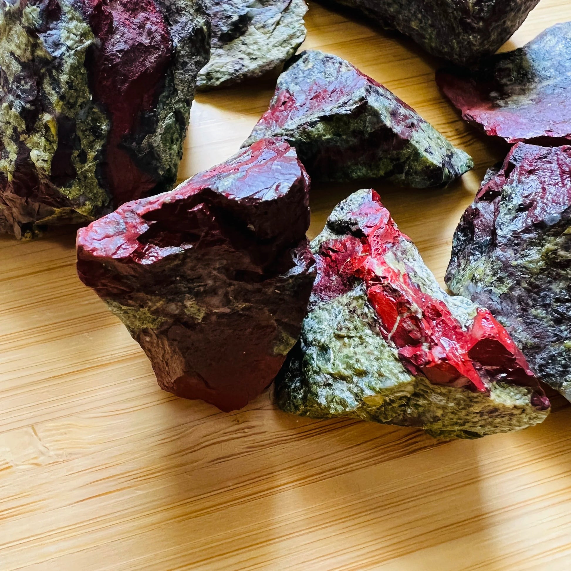 Profile shot of Dragon Bloodstone raw stone, showing characteristic color, from South Africa.