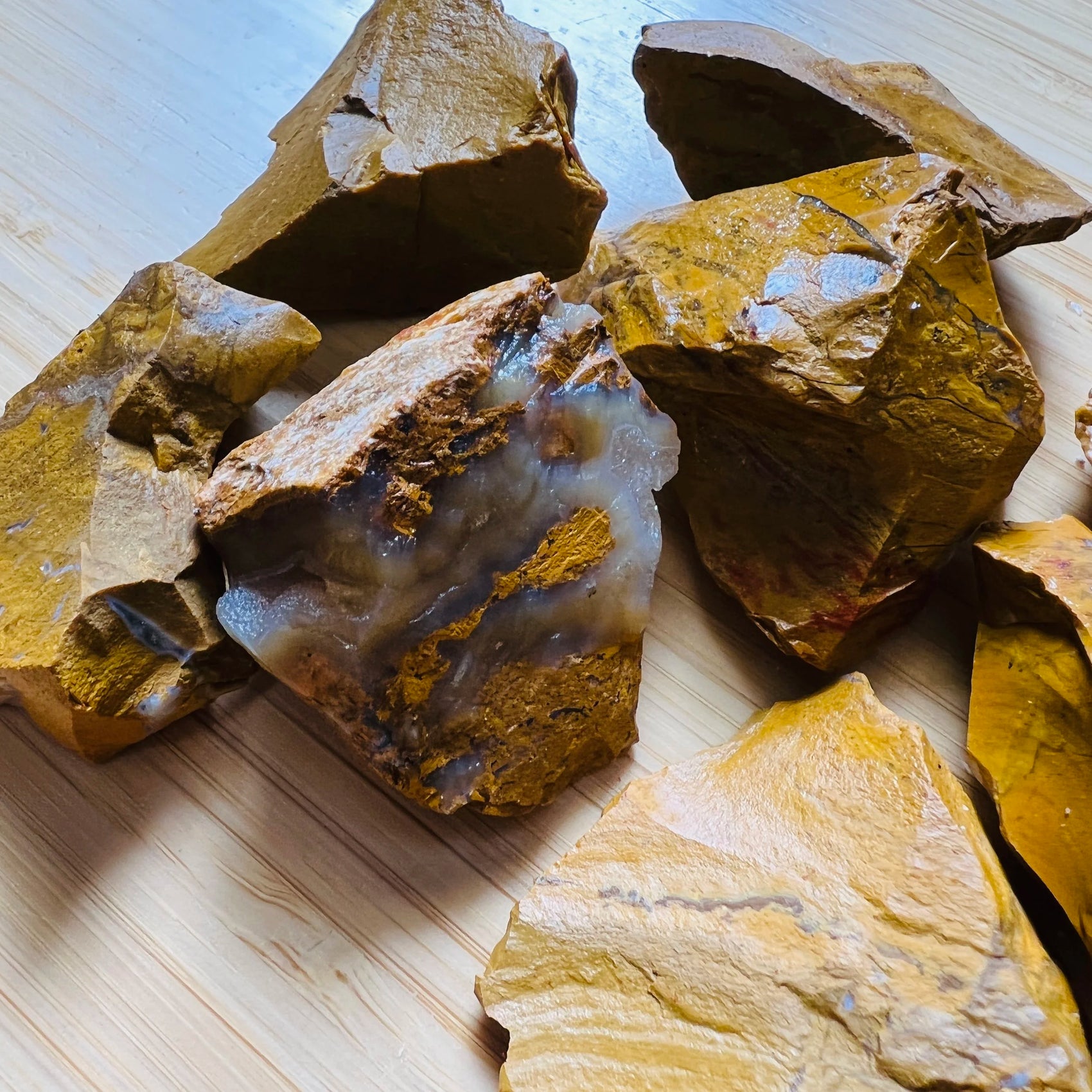 Grade aa yellow jasper raw held in hand for size reference