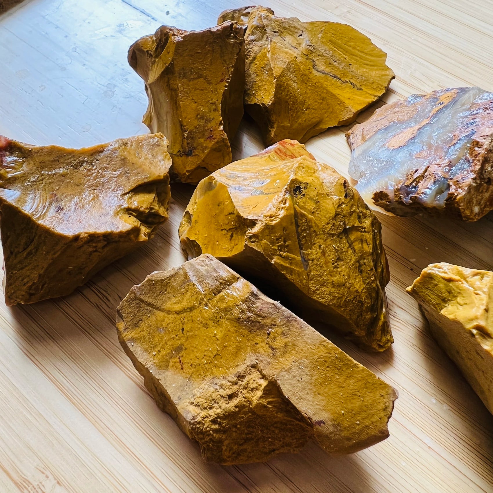 Back view of Grade AA Yellow Jasper raw showing natural surface