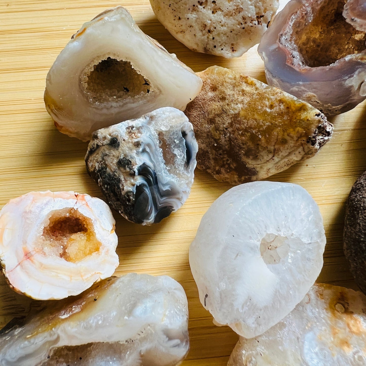 Profile view of multicolored Agate raw geode, showing natural texture, sourced from Brazil.