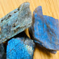 Side profile of Grade AAA Labradorite raw with natural form and inclusions