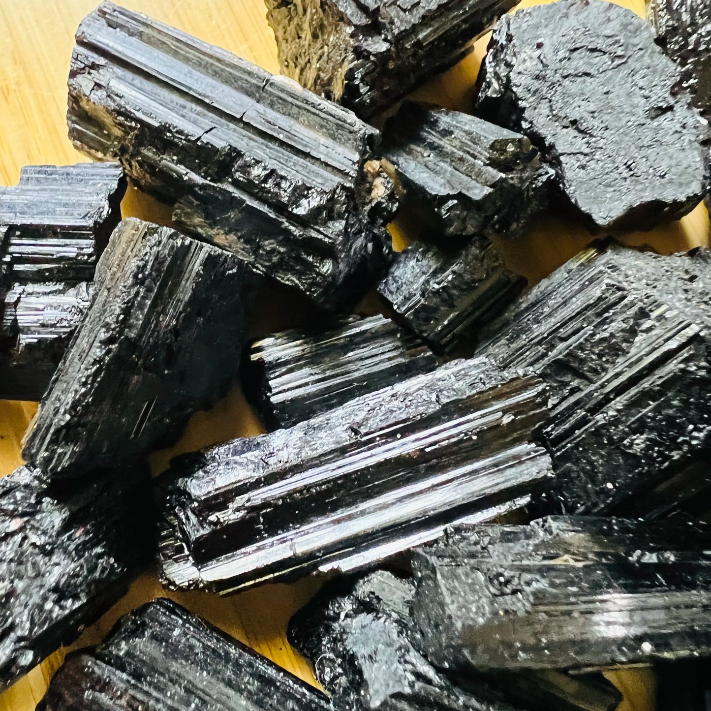 Detail shot of Grade AA Black Tourmaline raw under natural light