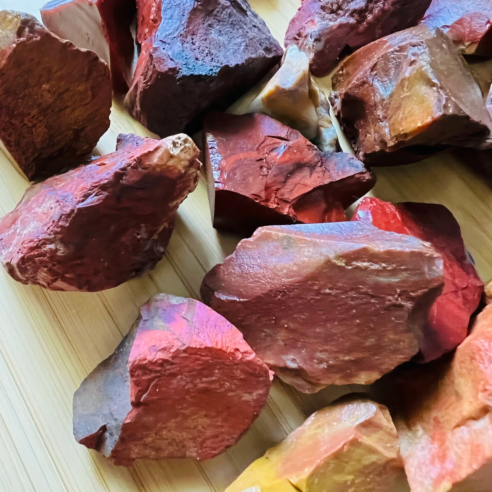 Side angle of Red Jasper raw stone, showing characteristic patterning, associated with Grounding.