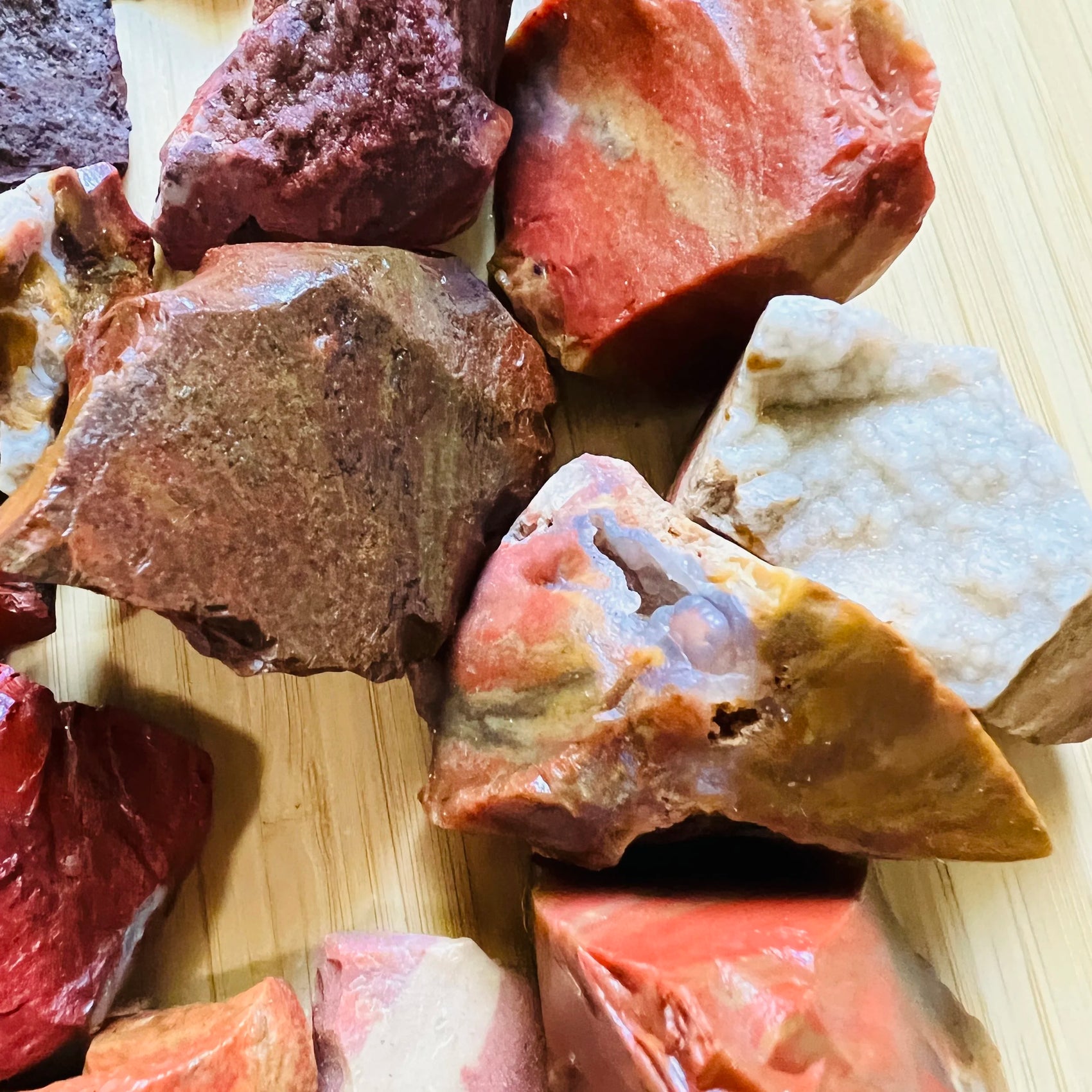 Overhead view of Red Jasper raw stone, Madagascar-sourced, to support Grounding.