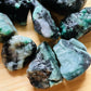 Back view of Grade A Emerald raw showing natural surface