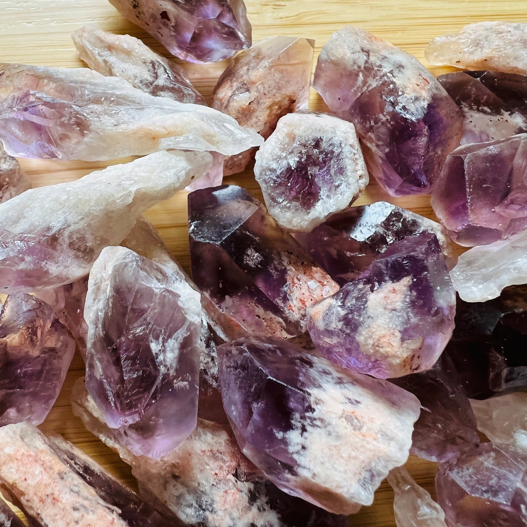 Natural light view of one Amethyst raw point for scale, sourced from Zambia.