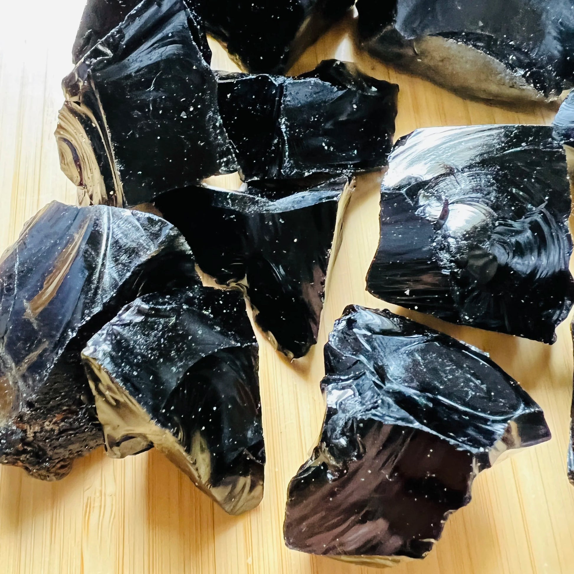 Back view of Grade AA Black Obsidian raw showing natural surface
