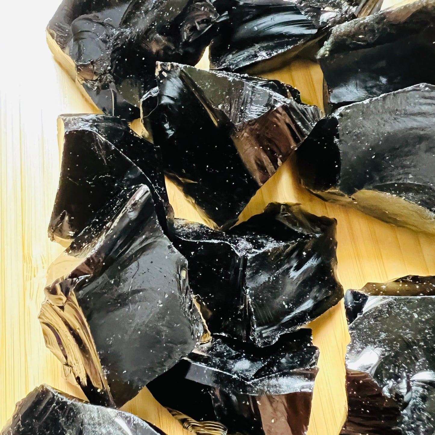 Detail shot of Grade AA Black Obsidian raw under natural light