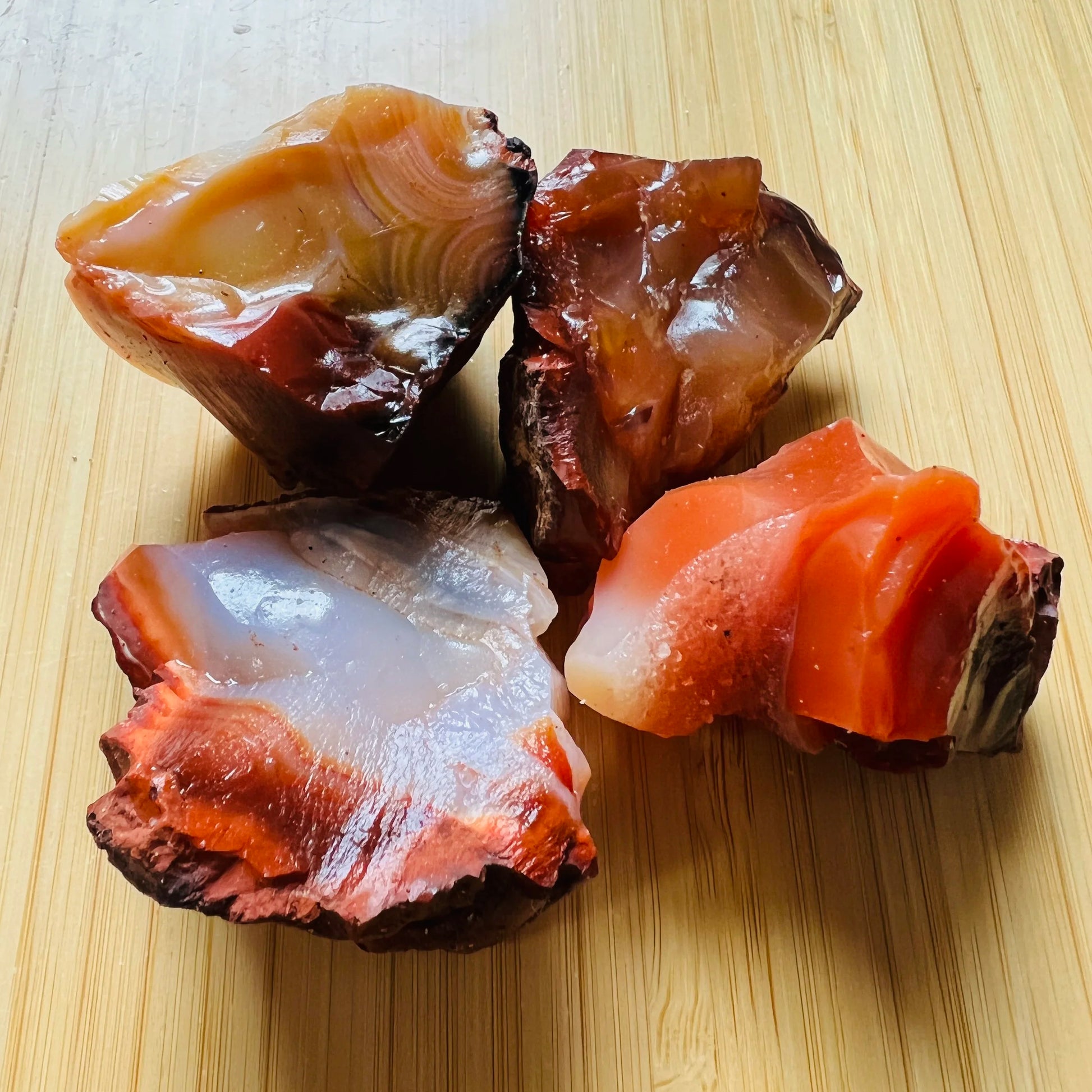 Close-up detail of Grade AA Carnelian raw showing natural orange, red tones and texture