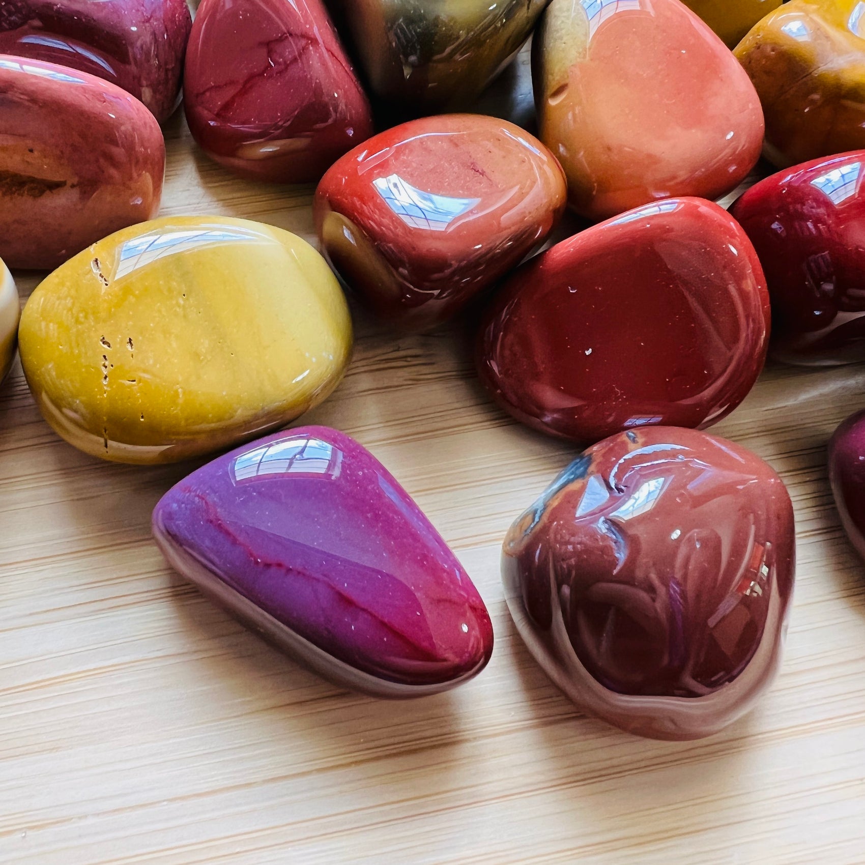 Surface detail of Mookaite tumbled stone, sourced from Australia, carried for Grounding.