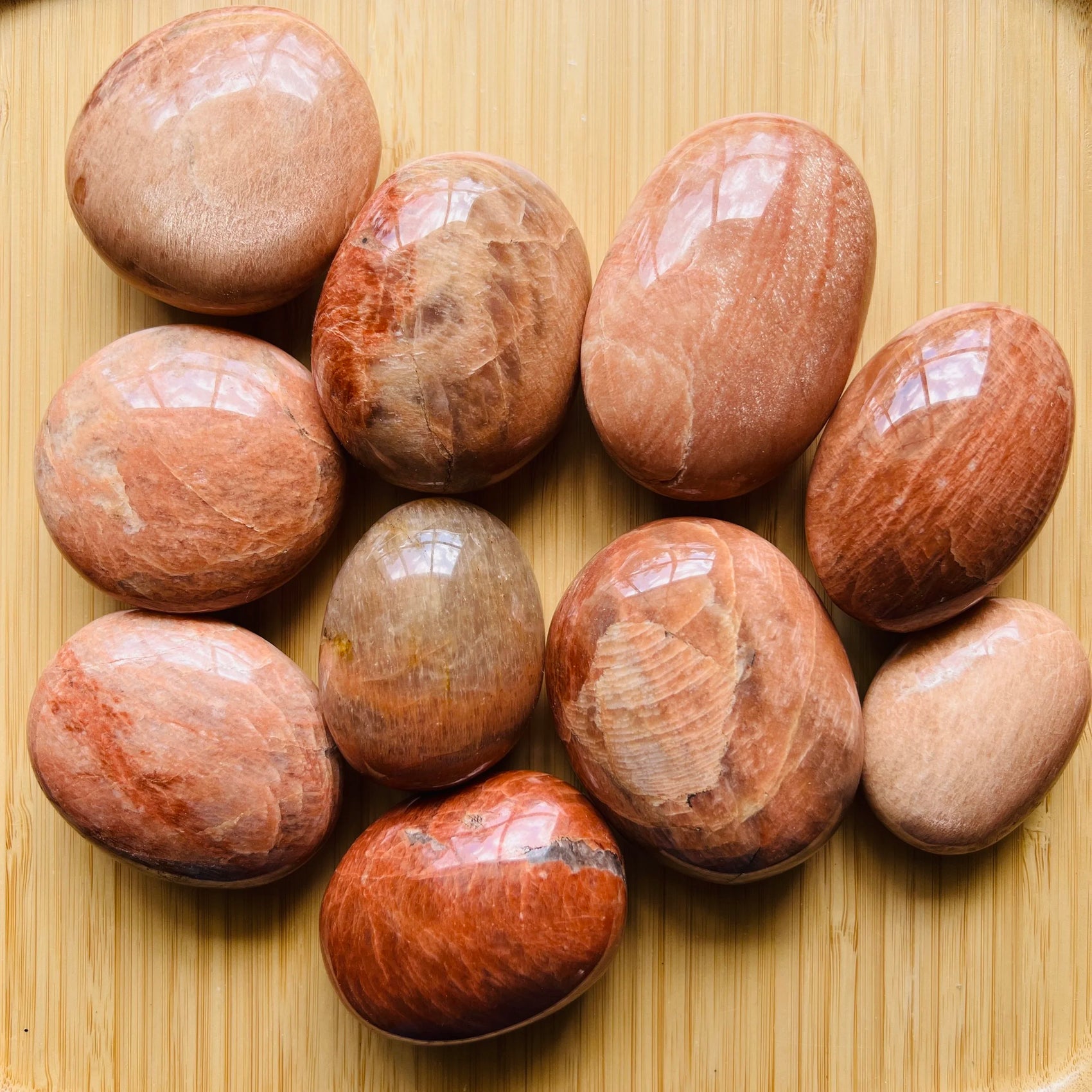Peach Moonstone palm stone in Peach tones, ethically sourced from Madagascar for Emotional Healing and Stress Relief