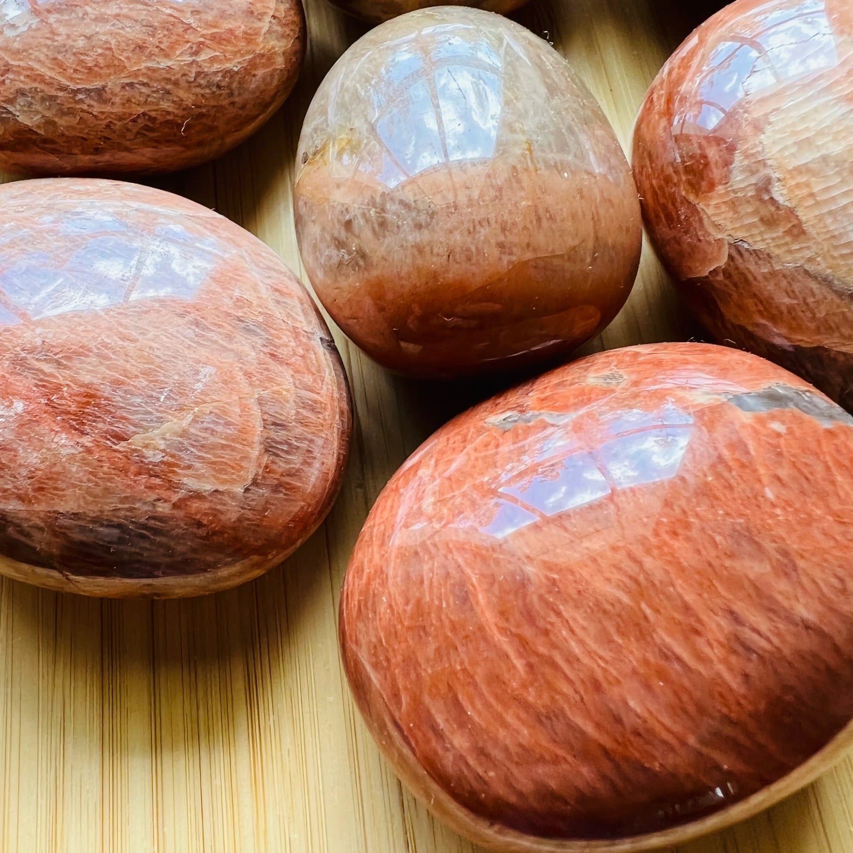 Close-up of Peach Moonstone palm stone from Madagascar, soothing wellness stone for Emotional Healing