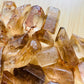 Top-down shot of Natural Citrine raw point, from Minas Gerais, Brazil, showing natural color depth.