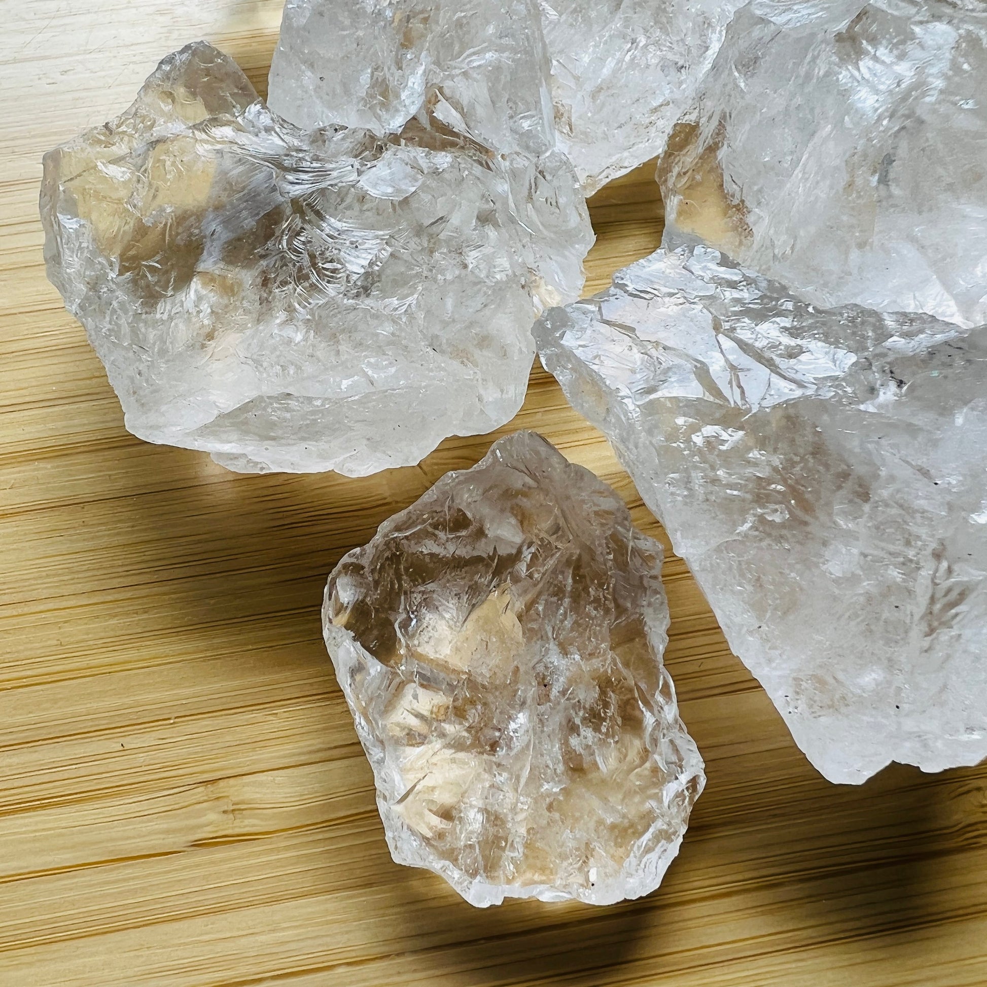 Side profile of Grade AA Clear Quartz raw with natural form and inclusions