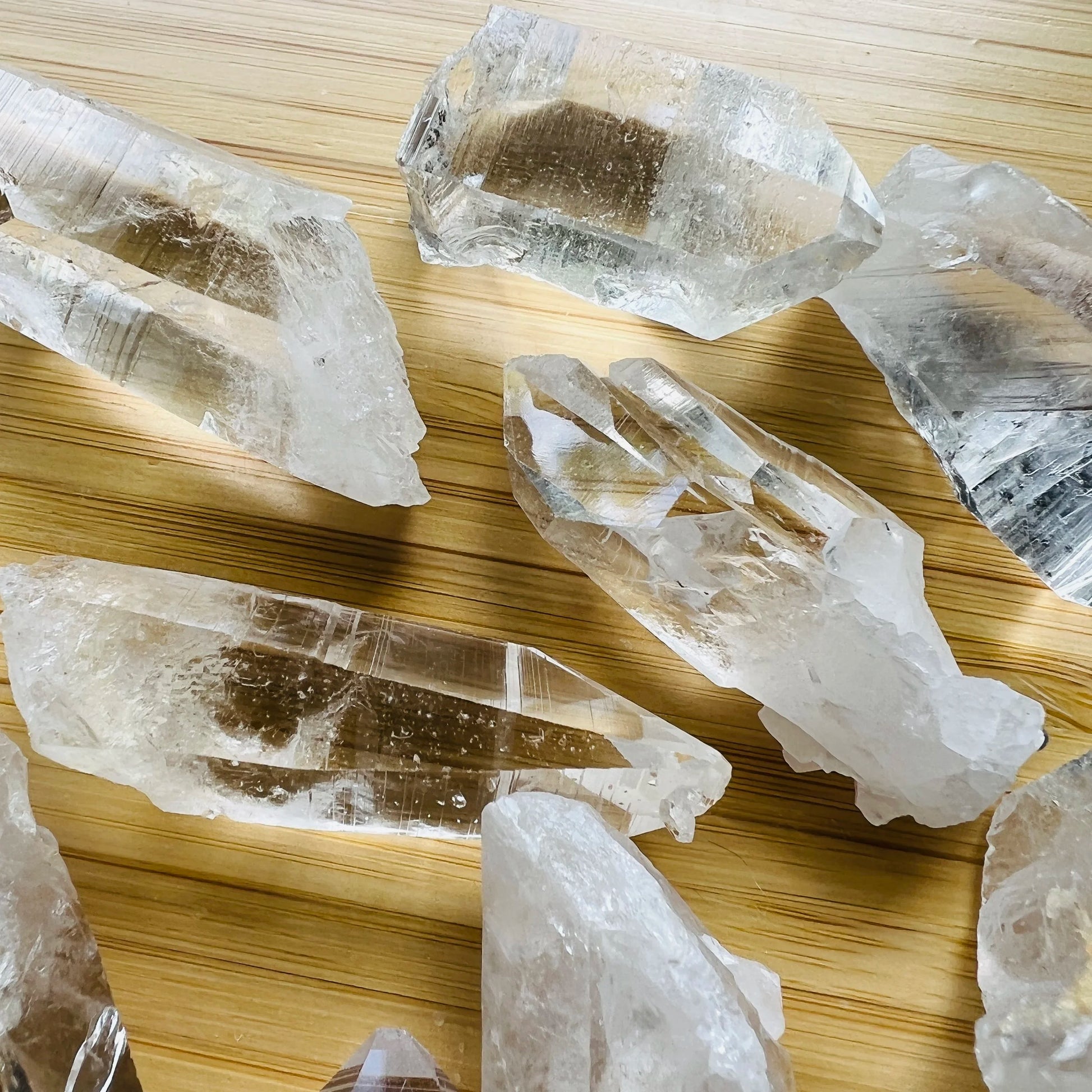 Three-quarter view of Clear Quartz raw crystal, from Arkansas, United States, associated with Healing, shown in a calm studio setting.