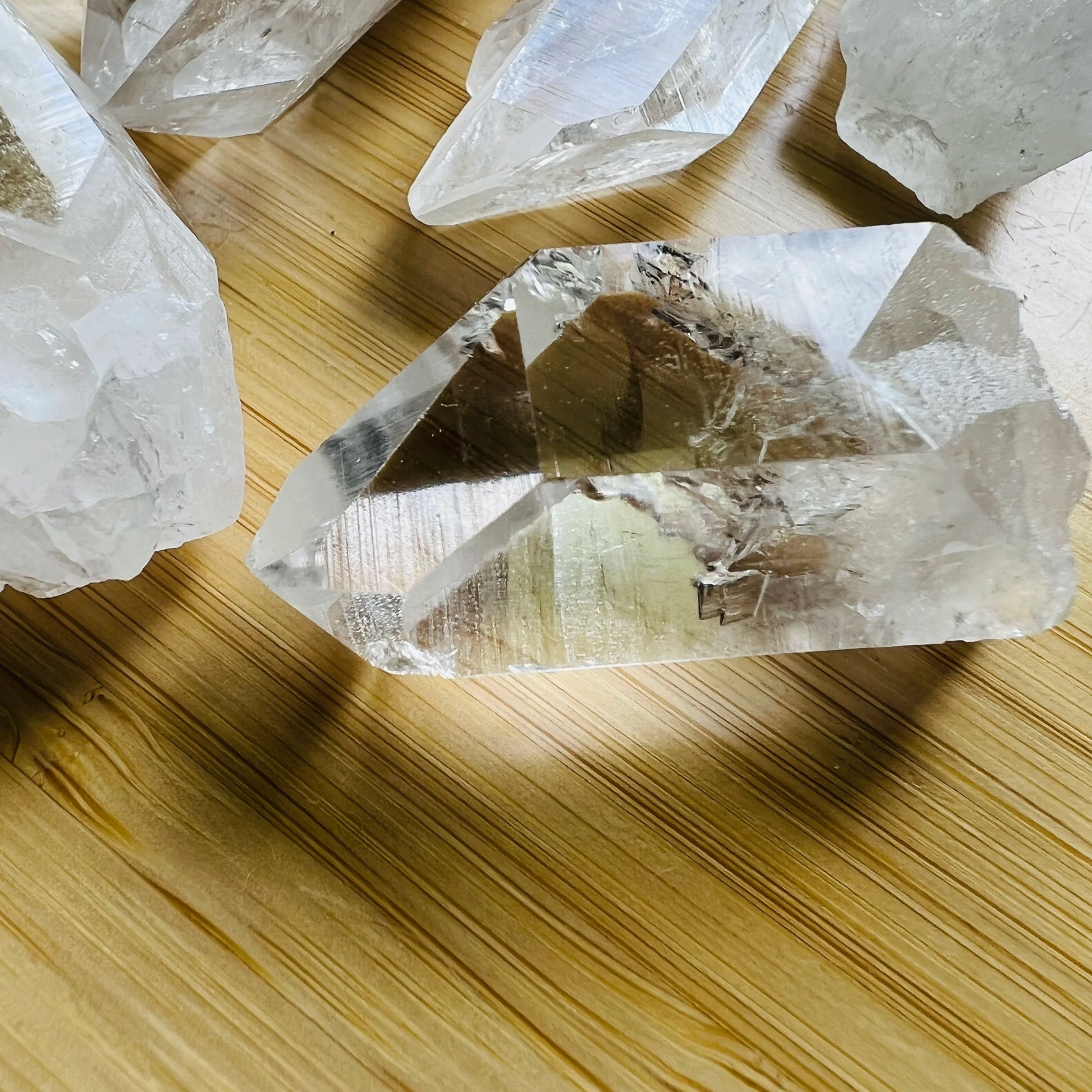 Close detail of Clear Quartz raw point, showing natural inclusions.