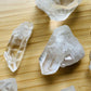 Side-on view of Clear Quartz raw point, showing characteristic color.