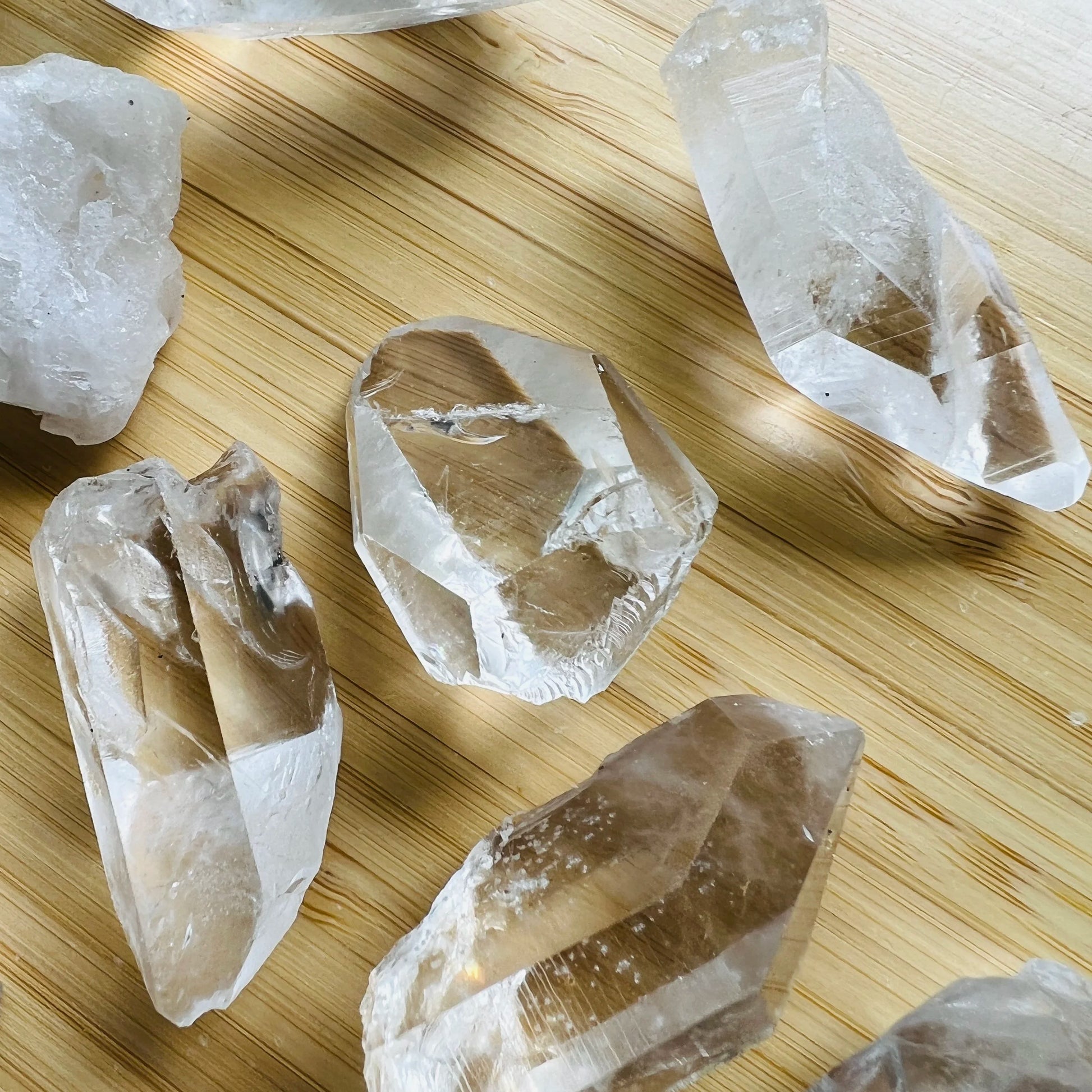 Looking down on Grade AA Clear Quartz raw point, showing characteristic finish, often worked with for Cleansing.