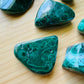 Companion image of Malachite tumbled stone, from Haut-Katanga, Democratic Republic of the Congo, showing the full body of the piece.