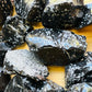 Reverse side of Snowflake Obsidian raw stone, hand-selected from Utah, United States, kept near for Grounding.