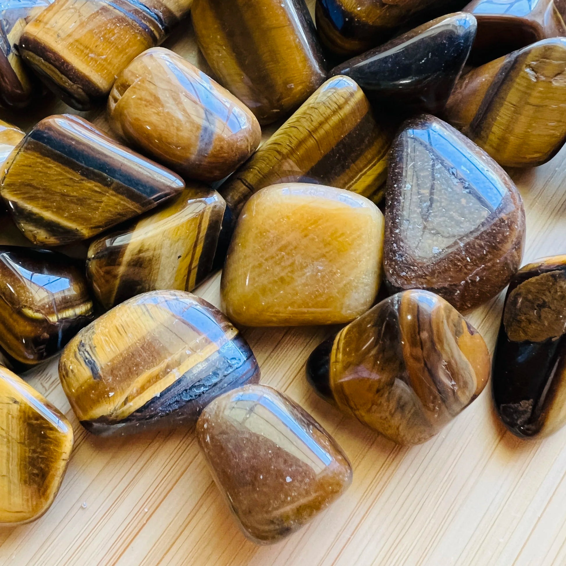 Full profile of Grade A Tiger Eye tumbled stone ready to ship from Beyond Bohemian