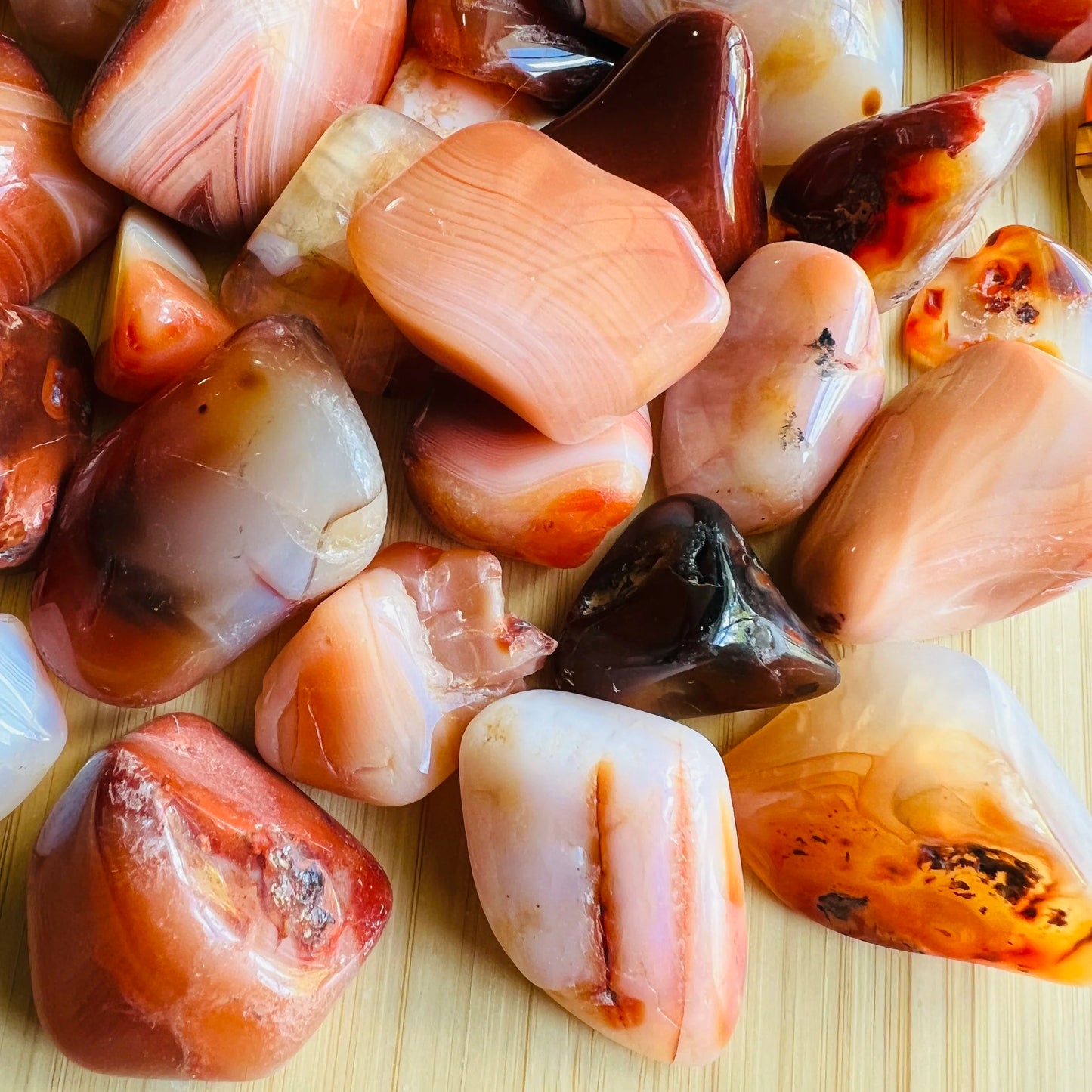 Alternate angle of Grade AA Carnelian tumbled stone showing overall shape