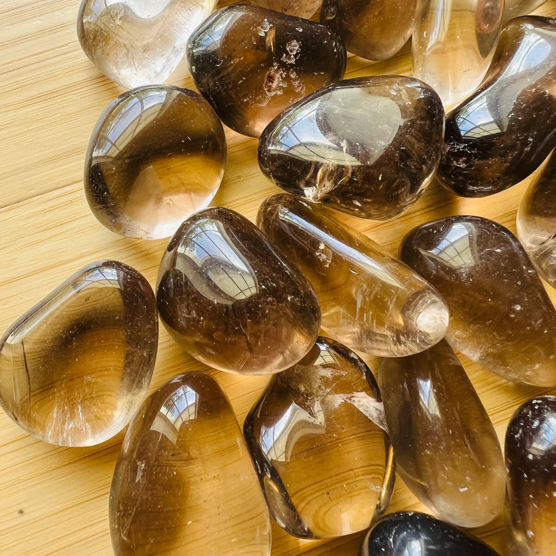 Back view of Grade AAA Smoky Quartz tumbled stone showing natural surface
