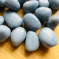Edge view of Angelite tumbled stone, often worked with for Stress Relief and Meditation, hand-selected from Huarochirí, Peru.