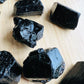Alternate angle of Grade AA Black Tourmaline raw showing overall shape