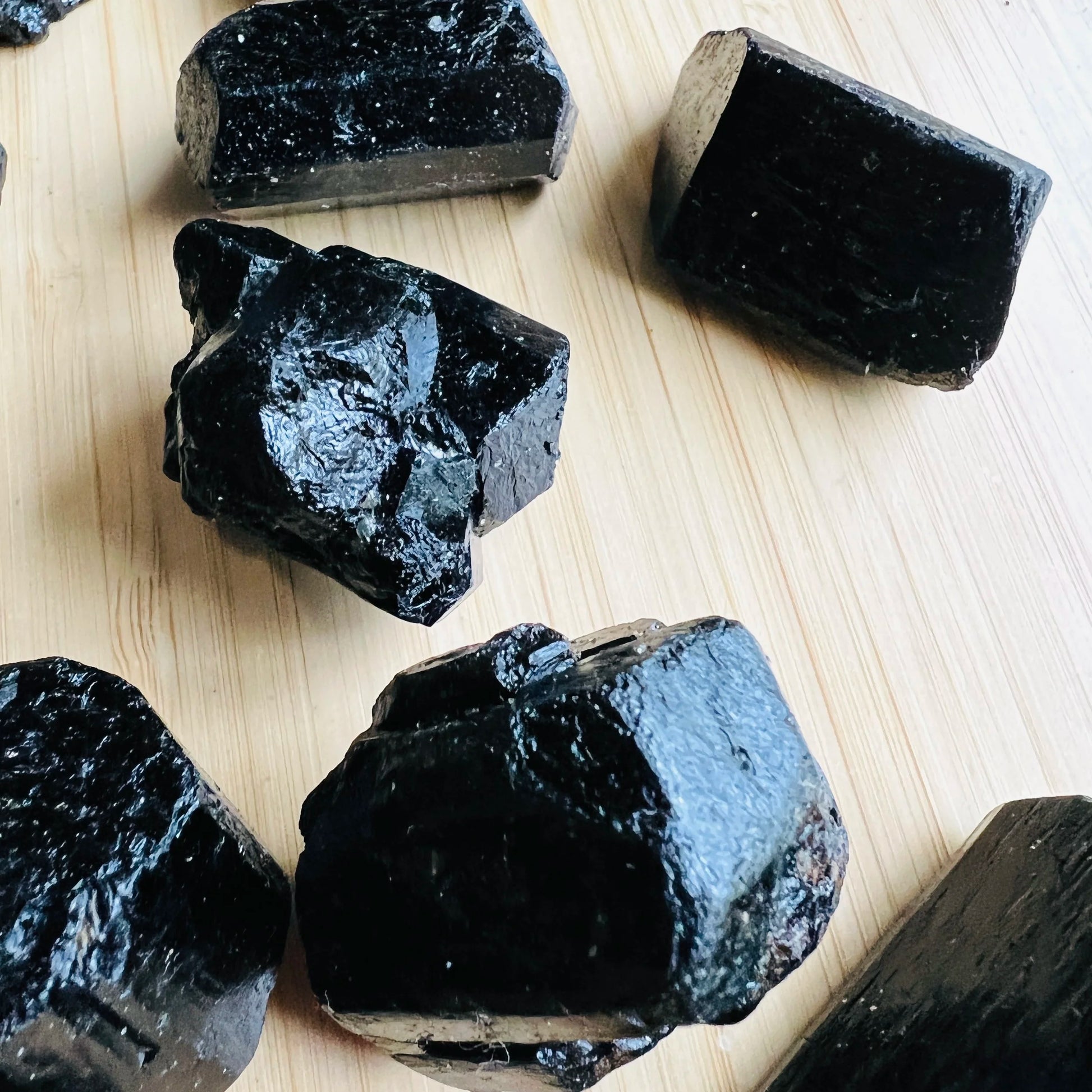 Alternate angle of Grade AA Black Tourmaline raw showing overall shape