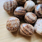 Texture-level view of Brown Aragonite tumbled stone, showing natural texture.