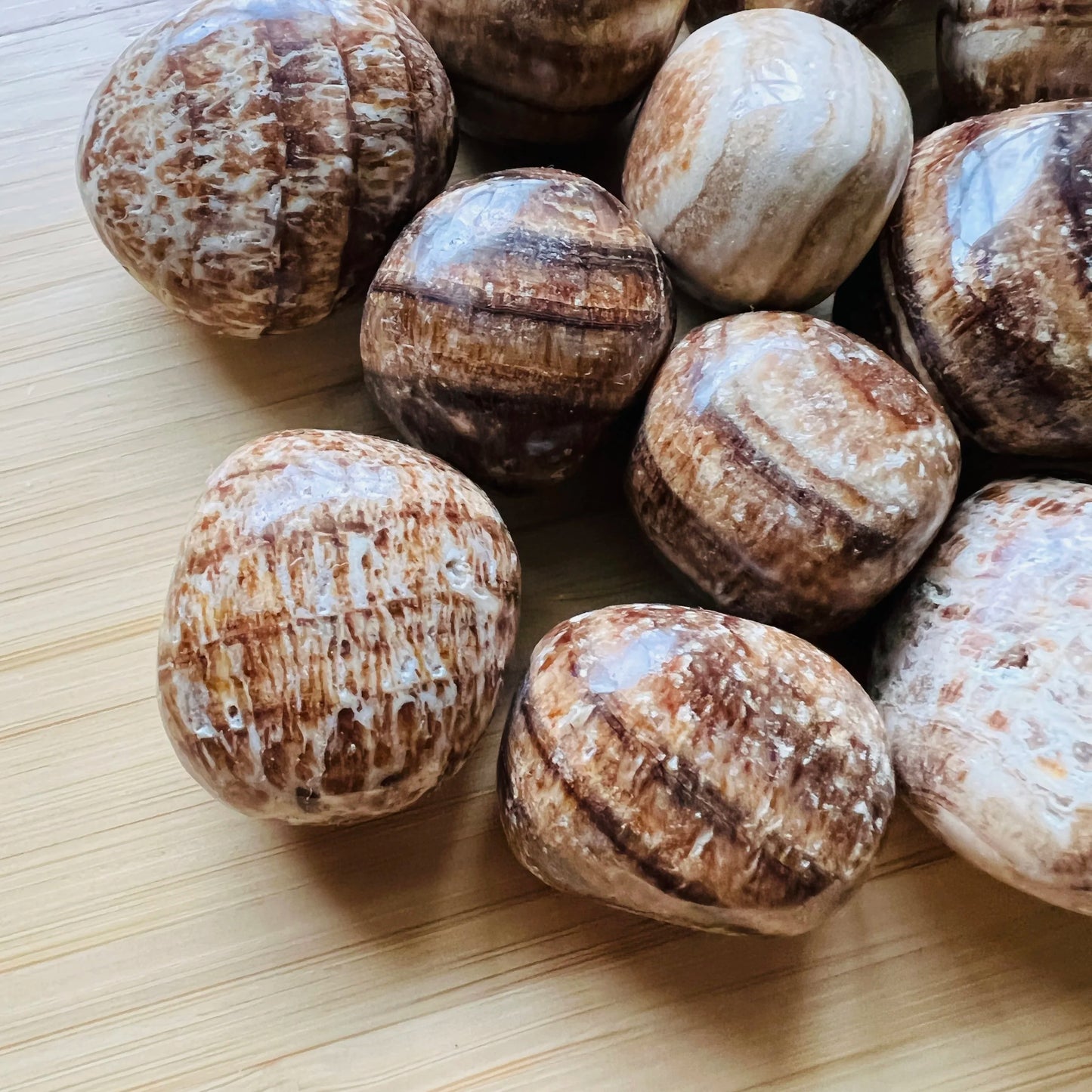 Texture-level view of Brown Aragonite tumbled stone, showing natural texture.