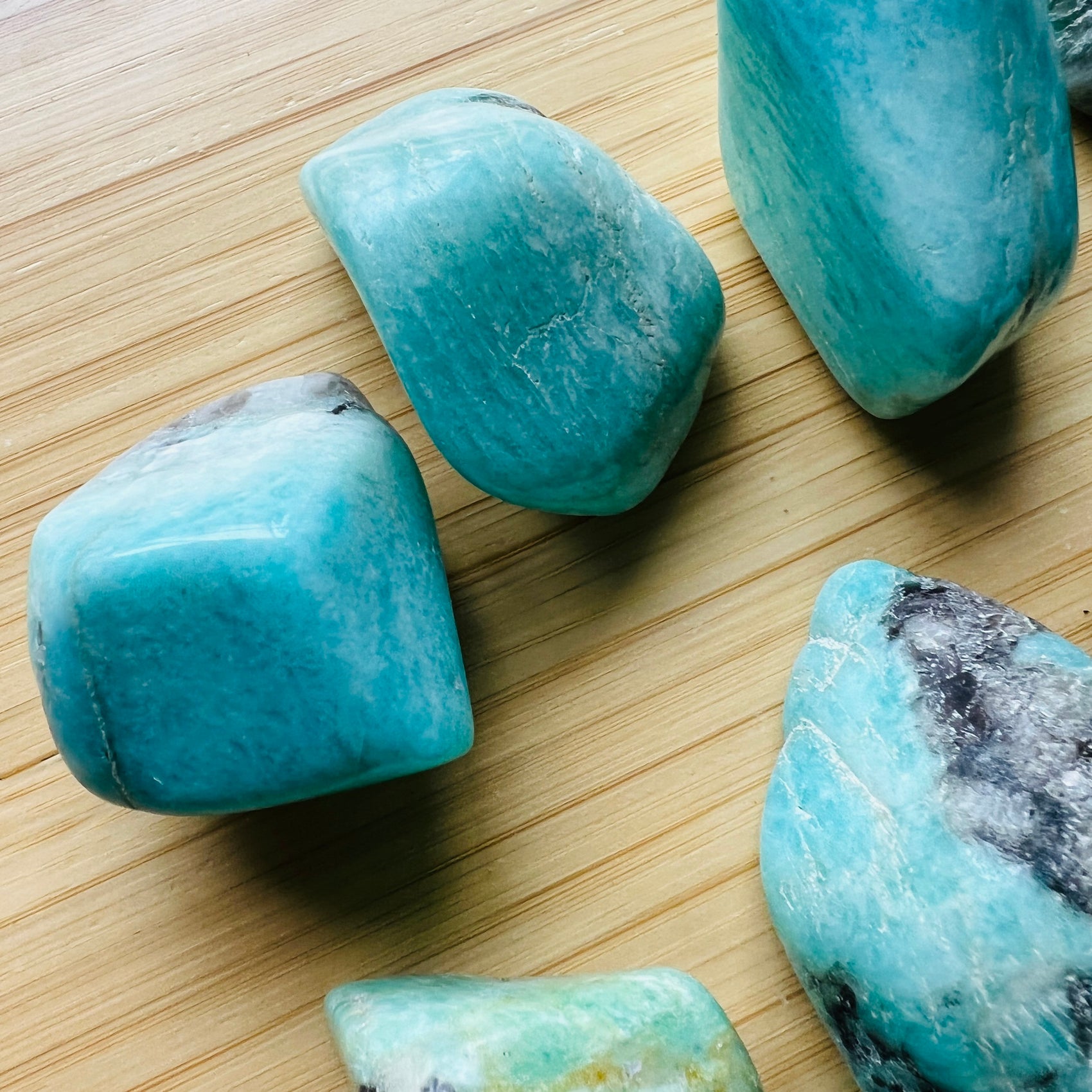 Back view of Grade AA Amazonite tumbled stone showing natural surface