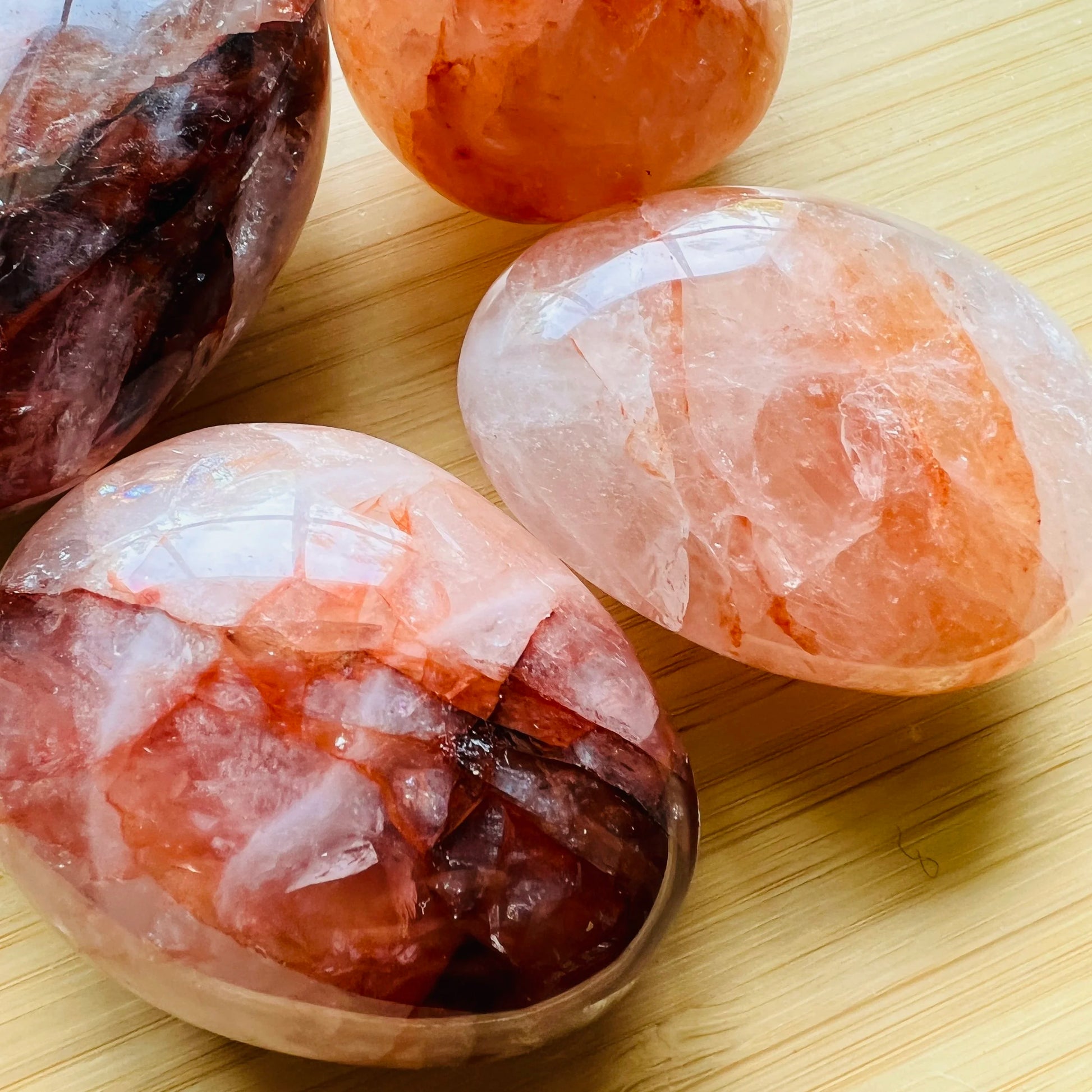 Side profile of Fire Quartz palm stone, Madagascar-sourced.