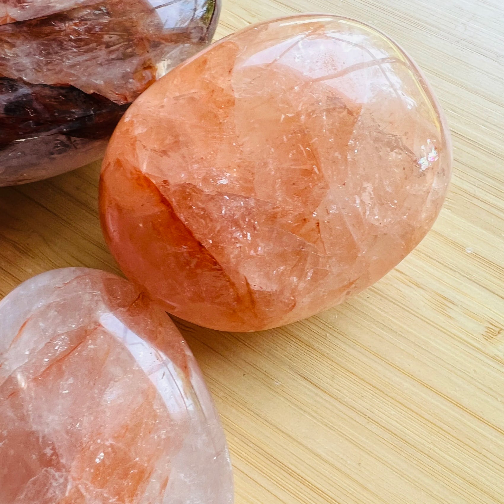 Top-side view of Fire Quartz palm stone, to support Grounding and Confidence.