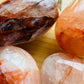 Underside detail of Fire Quartz palm stone, from Alaotra-Mangoro, Madagascar, often kept for Grounding.