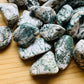Back view of Grade A Tree Agate tumbled stone showing natural surface