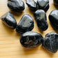 Close-up of Black Tourmaline tumbled stone from Brazil, soothing wellness stone for Stress Relief