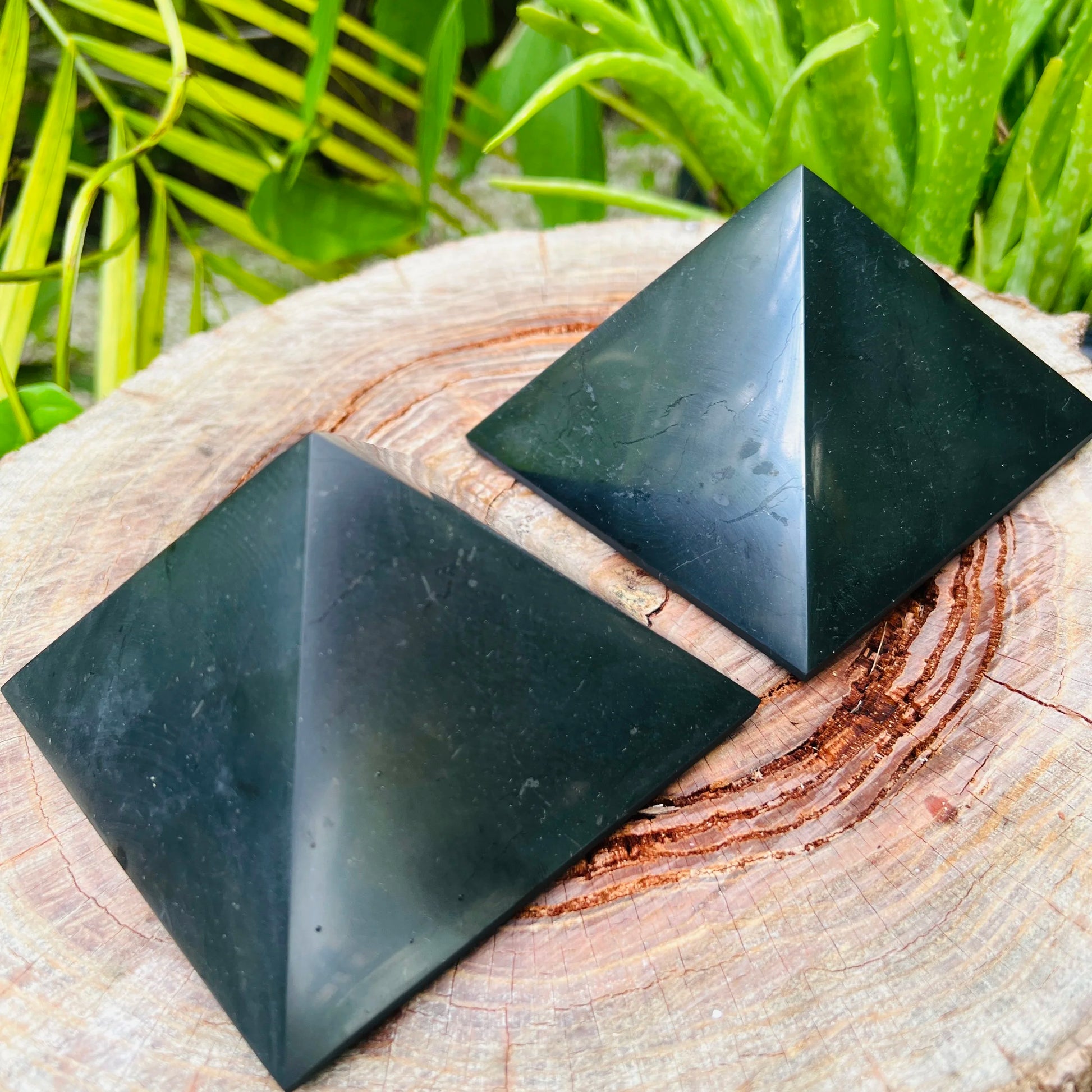 Natural surface of Shungite polished pyramid, often paired with practices around Protection.