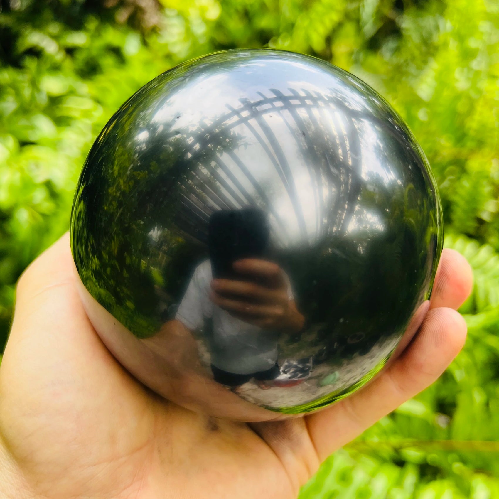 Top view of Shungite polished sphere, associated with Protection, from Republic of Karélia, Russia.