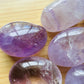 Daylight view of a Amethyst palm stone for Stress Relief.