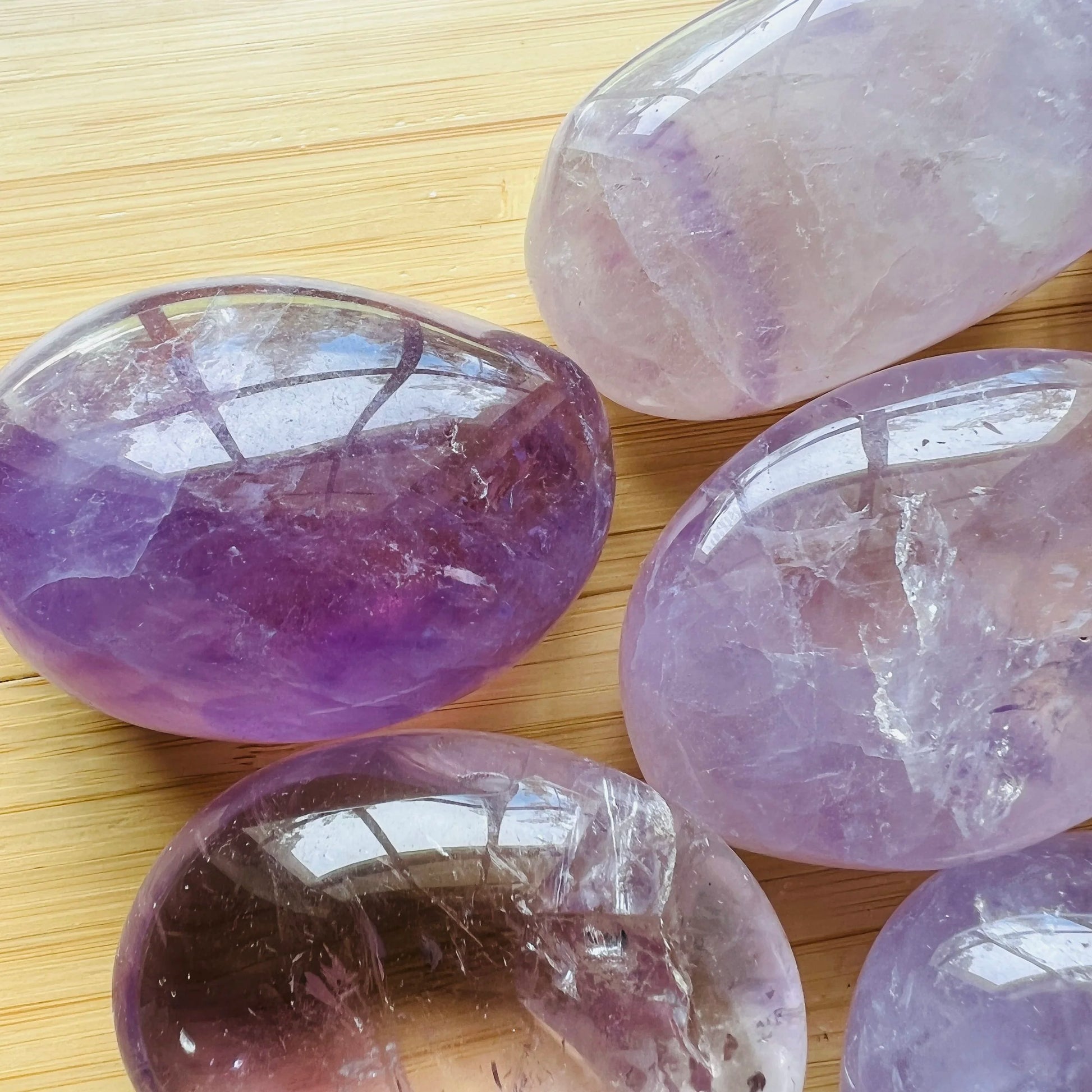 Daylight view of a Amethyst palm stone for Stress Relief.