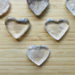 Side profile of Clear Quartz polished heart, linked to Cleansing and Meditation.