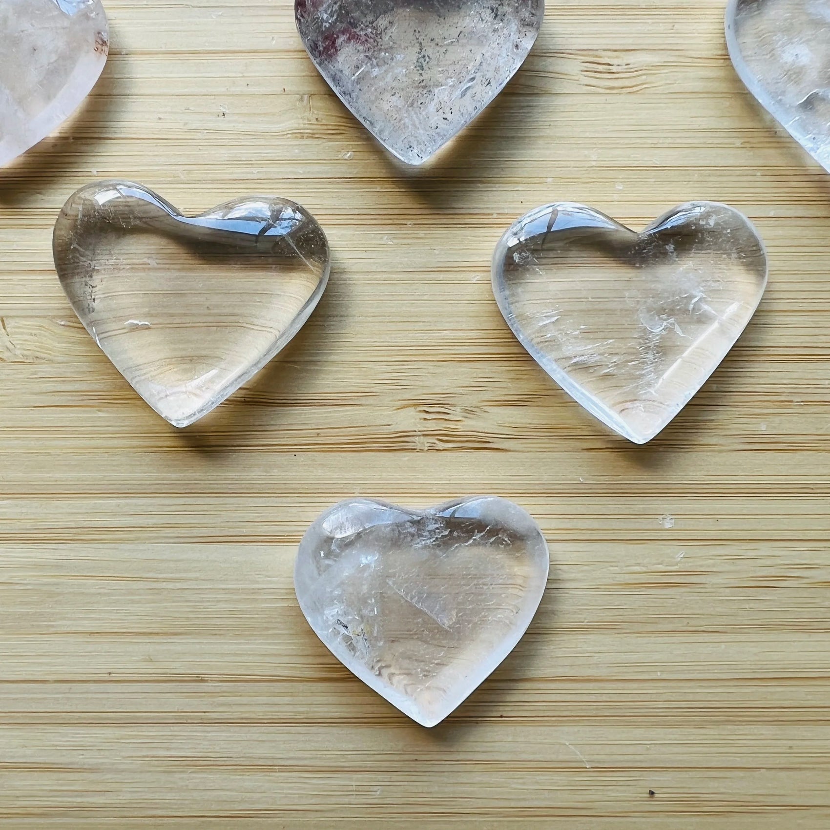 Side profile of Clear Quartz polished heart, linked to Cleansing and Meditation.